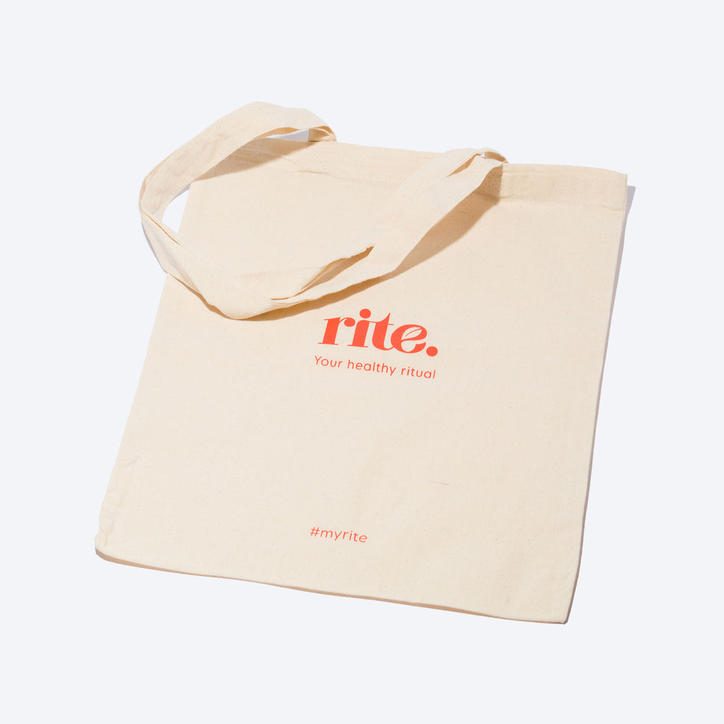 A tote bag with the words "rite. Your healthy ritual" on it. 