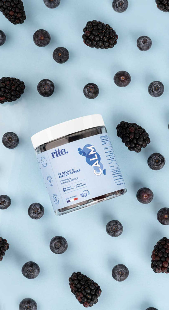 CALM GUMMIES shown with blackberries and blueberries—support relaxation and stress relief with these tasty daily supplements.