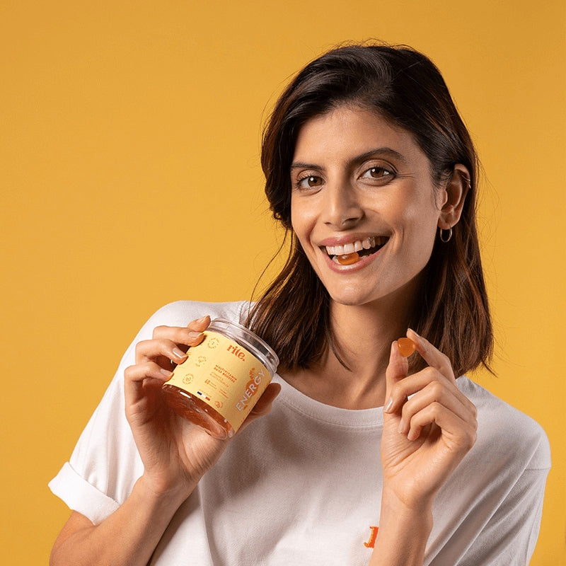 ENERGY GUMMIES jar with orange gummies, packed with vitamins for daily energy and focus support – perfect for busy lifestyles.