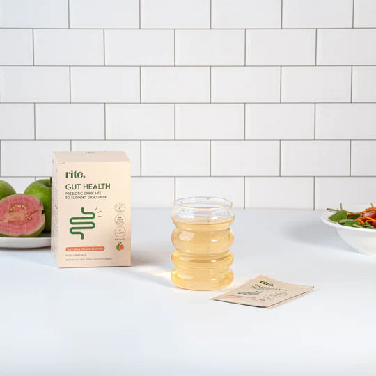 GUT HEALTH prebiotic drink mix in guava flavor, shown with the product box, sachet, and a prepared drink for digestion support