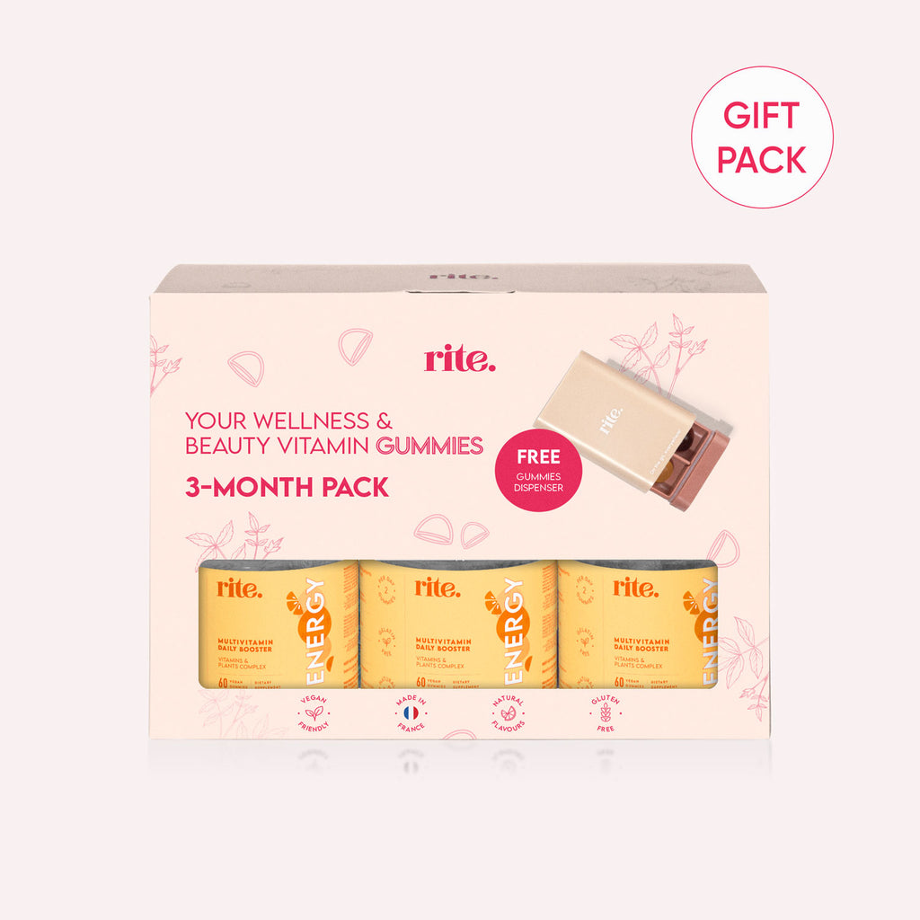 A white box with blue and pink text that says "rite. Your Wellness & Beauty Vitamin Gummies 3-Month Pack" and a free gift pack. 