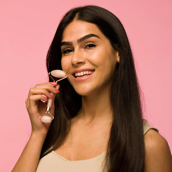 ROSE QUARTZ ROLLER with dual ends designed for facial massage and improved skincare routine 