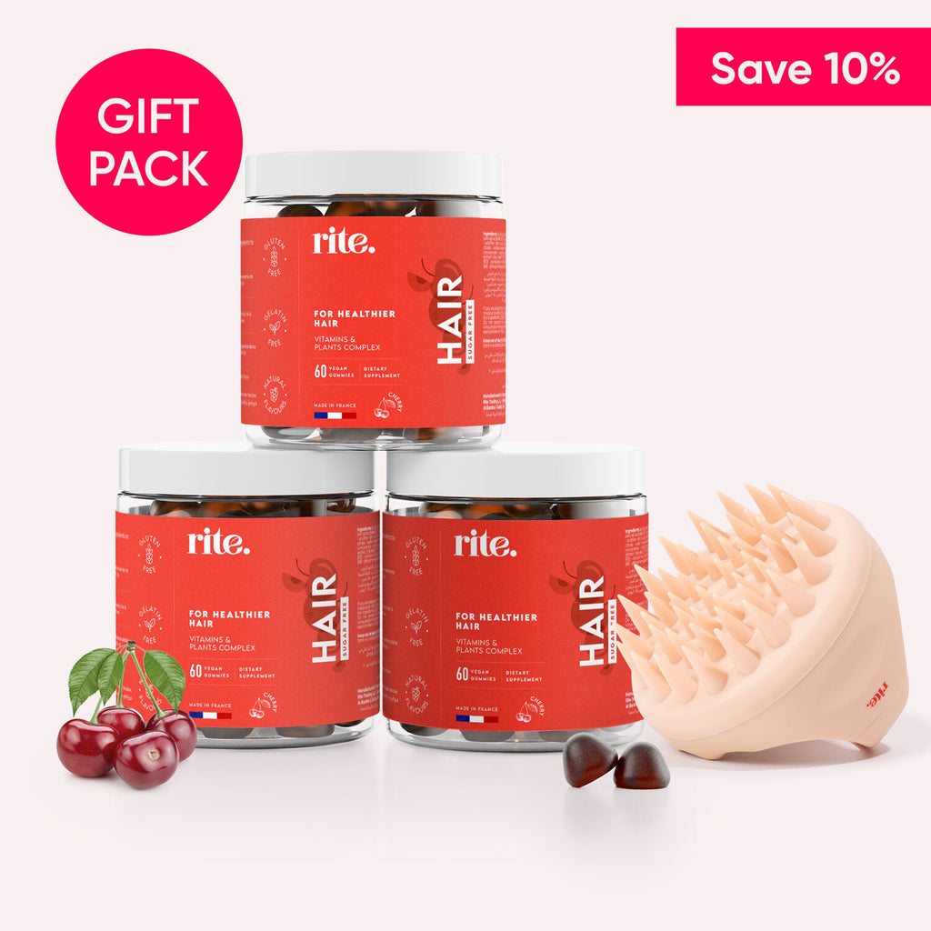 Three jars of Rite Hair gummy vitamins and a hairbrush on a white background.Text on the box says "Save 10%” and "Gift Pack".