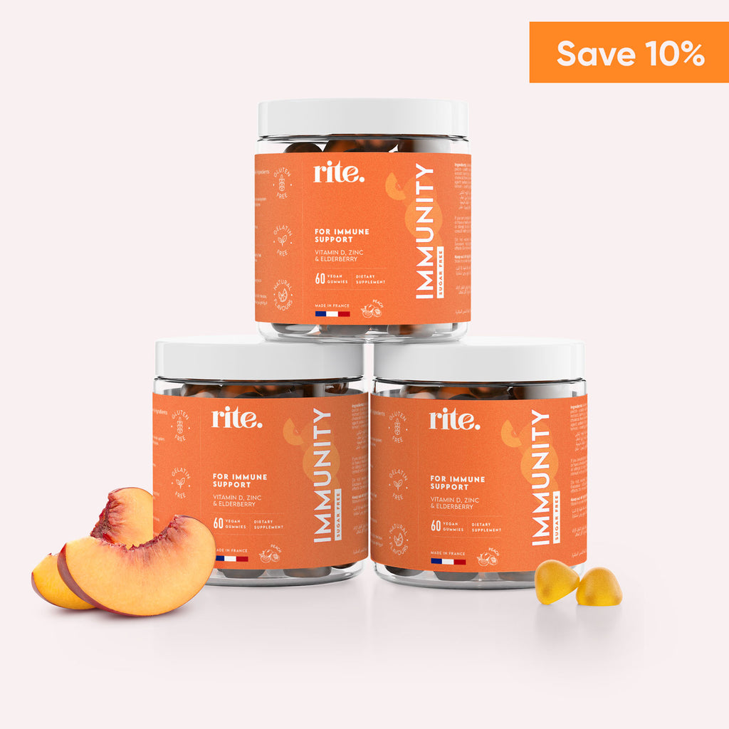 Three jars of Rite IMMUNITY Gummies stacked on top of each other with a peach on a white background.