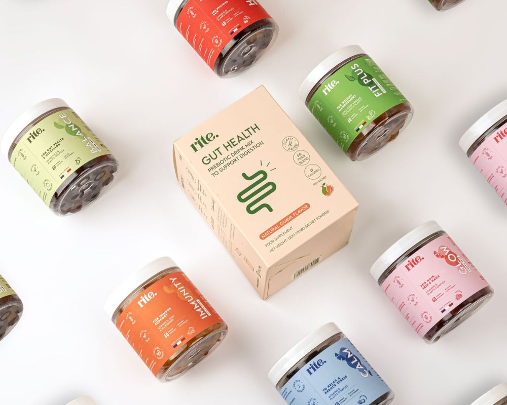 Assorted supplement bundles including GUT HEALTH and other wellness jars displayed on a white surface, emphasizing daily nutrition.
