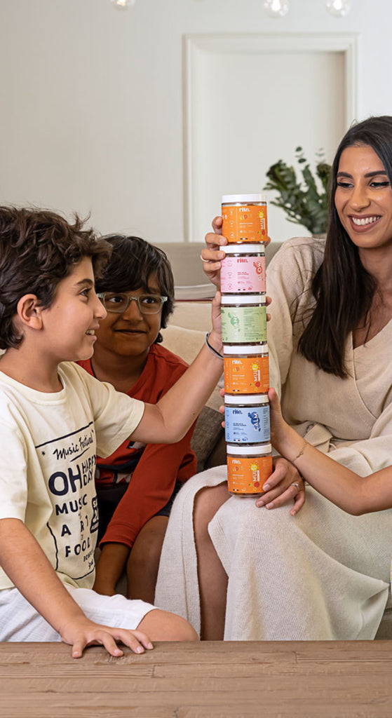 Stacked jars of RITE GUMMIES including CALM, GLOW, BALANCE, IMMUNE, and MULTIVITAMIN, supporting complete daily family wellness.