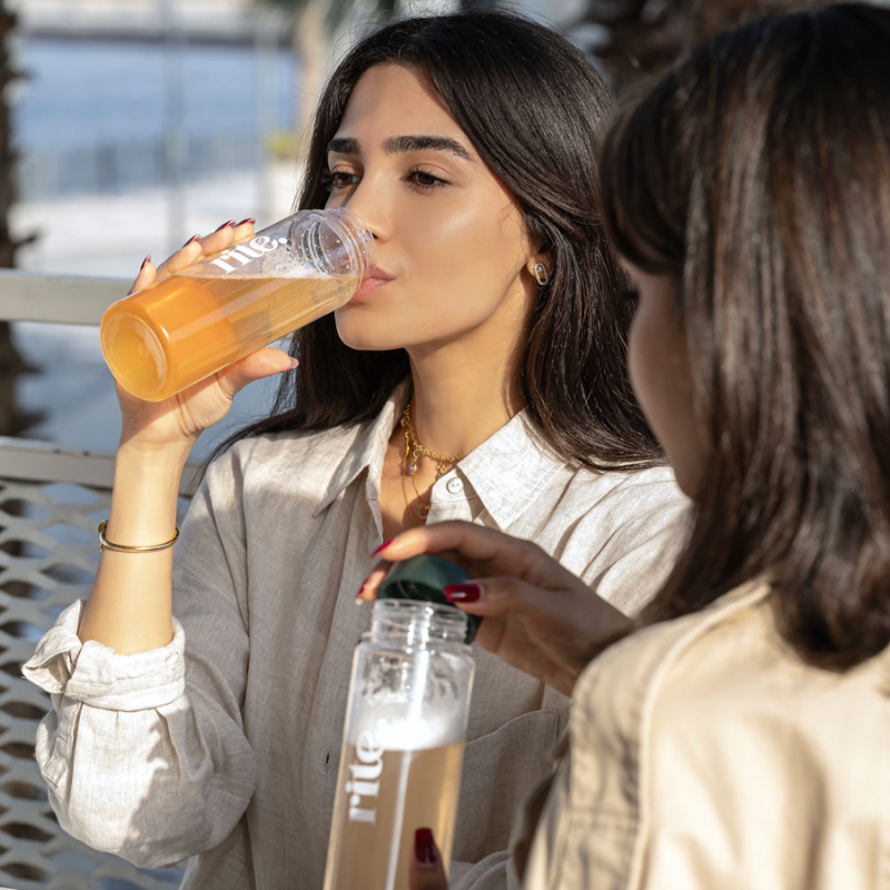RITE-branded BOTTLES filled with refreshing wellness drinks, designed for daily hydration and vitamin infusion on the go.